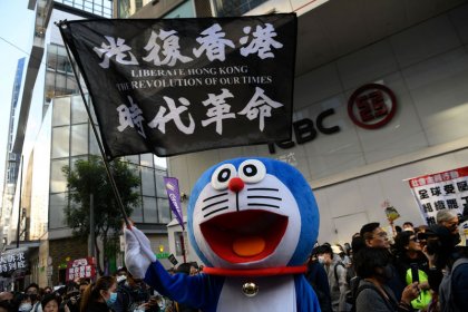 Thousands of protesters throng streets of Hong Kong as government urges calm