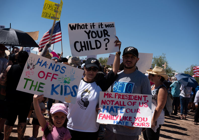 people participate in a protest against a recent u.s.