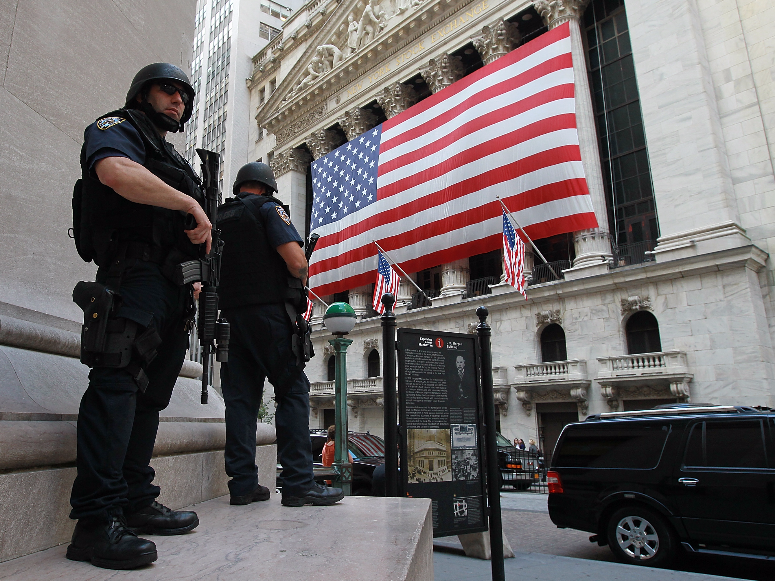 &copy; Justin Sullivan/Getty Images, NYPD tactical police officers stand guard near the New York Stock Exchange on September 9, 2011, in New York City.