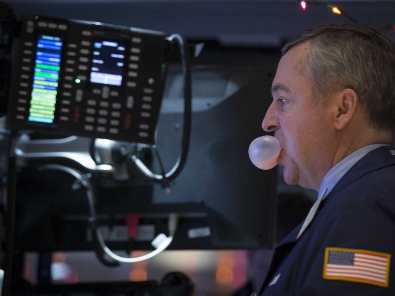 &copy; REUTERS/Brendan McDermid, A trader works on the floor of the New York Stock Exchange December 4, 2014. 