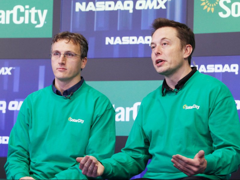 &copy; Mark Von Holden/AP, Lyndon Rive (left) and Elon Musk (right).