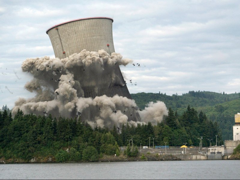 &copy; Steve Dipaola/Reuters, A cooling tower at Trojan Nuclear Plant is imploded in Rainier.