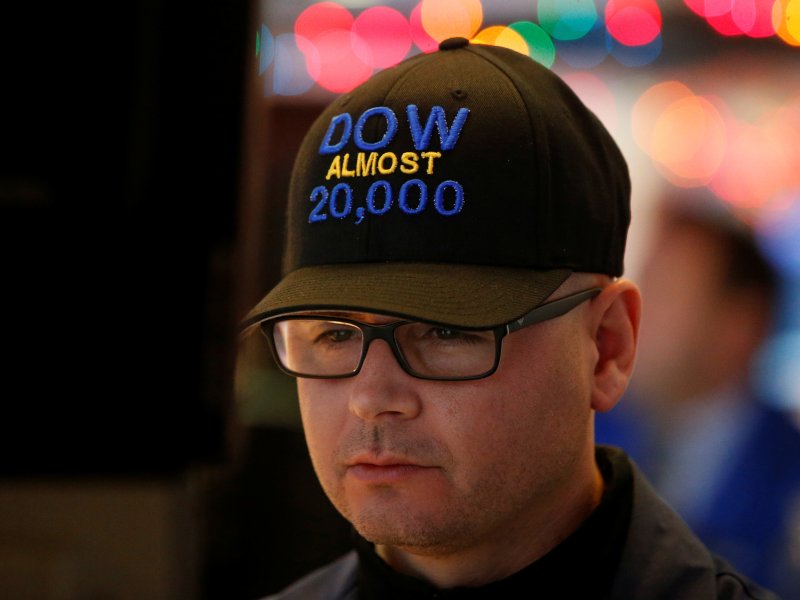 &copy; Brendan McDermid/Reuters, Specialist trader Mario Picone wears a &quot;DOW Almost 20,000&quot; cap as he works at his post on the floor of the New York Stock Exchange (NYSE) in New York City, U.S., December 15, 2016.