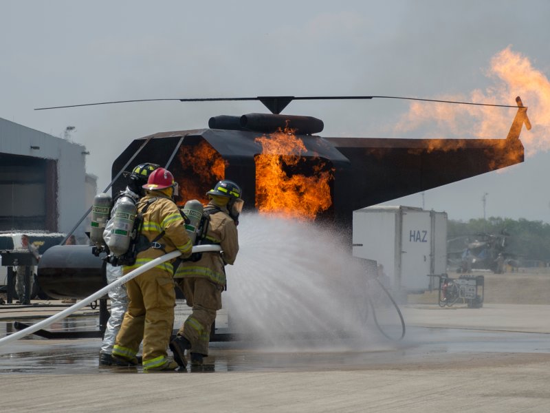 &copy; US Air Force/Capt. David Liapis, Firefighters in training put out a helicopter fire, much like the Fed could extinguish the rally in high-flying tech stocks.