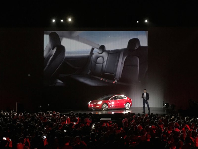 &copy; Reuters Staff, Tesla CEO Elon Musk presents the Model 3 at a handover party in Fremont, California on July 28.