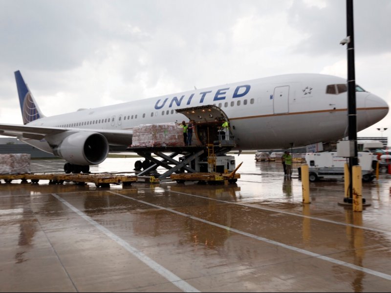 &copy; United Airlines, A United Airlines Boeing 777-300ER unloading relief supplies in Houston.