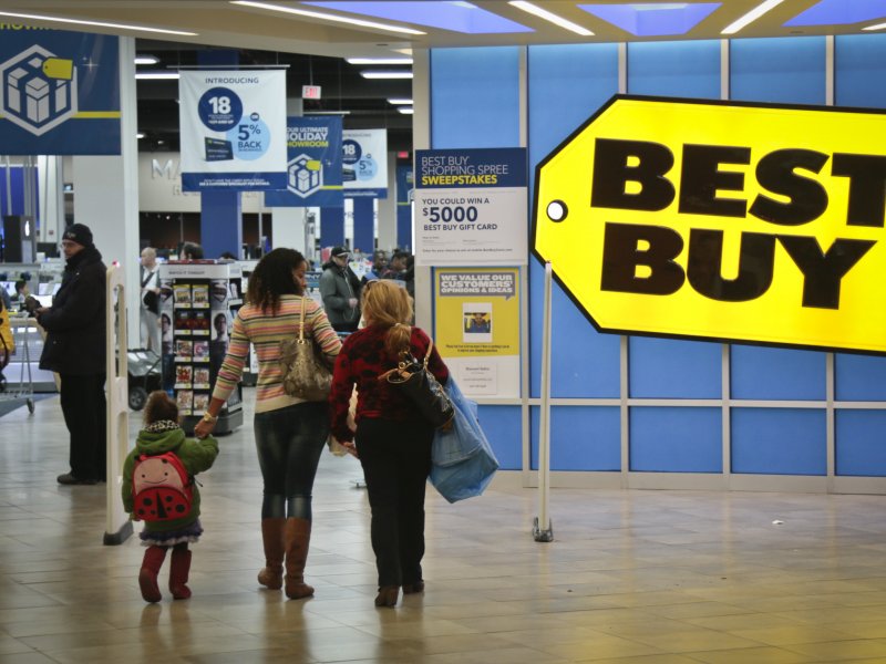 &copy; Associated Press/Bebeto Matthews, In this Nov. 23, 2013, file photo, shoppers enter a Best Buy in New York.