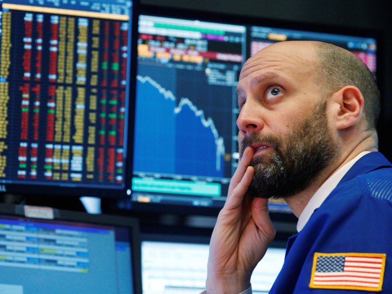 &copy; Reuters/Brendan McDermid, A trader reacts as he watches screens on the floor of the New York Stock Exchange in New York