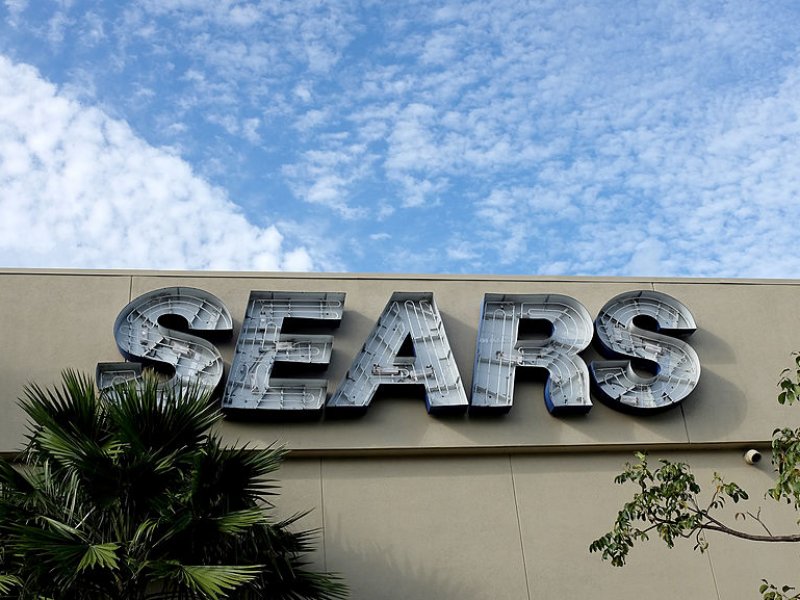 &copy; AP Photo/Charlie Riedel, A Sears store slated for closing stands alongside a mall that is being torn down Saturday, July 8, 2017, in Overland Park, Kan.