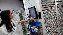 Nikkei dips but stimulus, vaccine hopes lift Tokyo shares