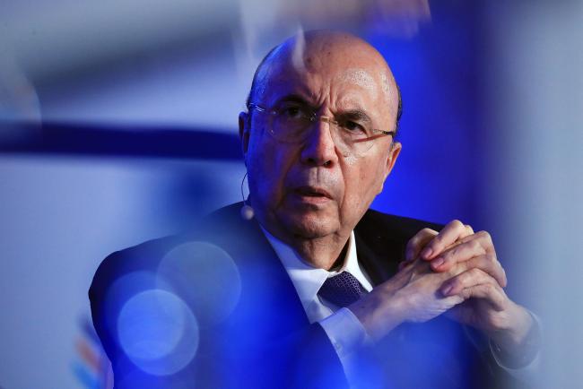 © Bloomberg. Henrique Meirelles, Brazil's finance minister, looks on during the Institute of International Finance G-20 Conference in Frankfurt, Germany, on Thursday, March 16, 2017. Some of the top financial services companies, including BlackRock Inc. and UBS Group AG, warned against rolling back financial regulation at this time, saying it could be risky and distort international competition.