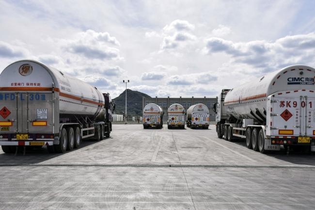 &copy Bloomberg. LNG tankers at ENN's terminal. Photographer: Qilai Shen/Bloomberg