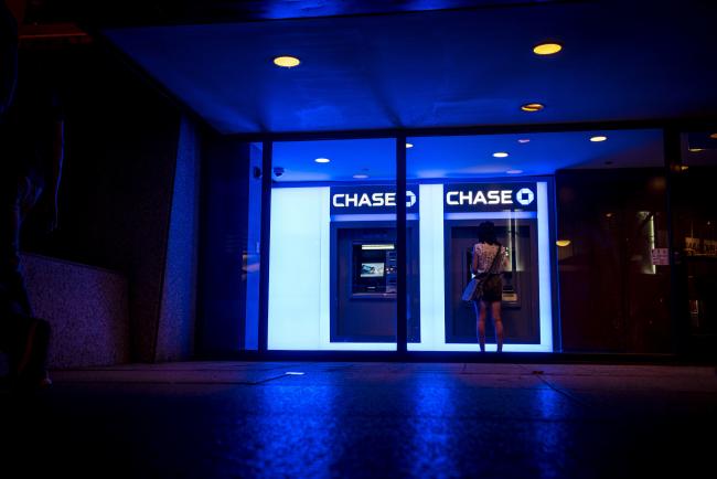 © Bloomberg. A customer uses an automatic teller machine (ATM) at a JPMorgan Chase & Co. bank branch in Chicago. Photographer: Christopher Dilts/Bloomberg