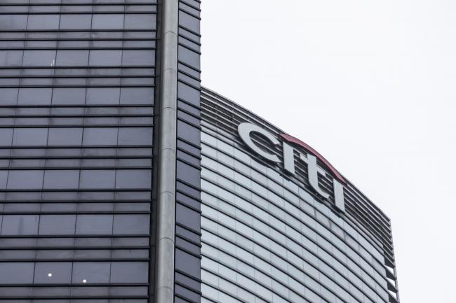© Bloomberg. The Citigroup Inc. logo is displayed atop the Champion Tower, right, in Hong Kong, China, on Saturday, March 23, 2019. Citigroup, the global investment bank with a major presence in Asia, has ousted eight equities traders in Hong Kong and suspended three others after a sweeping internal investigation into its dealings with some clients, people familiar with the matter said. Photographer: Justin Chin/Bloomberg