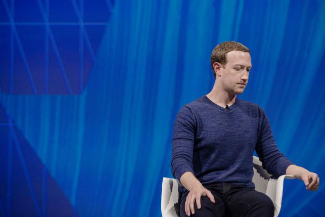 © Bloomberg. Mark Zuckerberg, chief executive officer and founder of Facebook Inc., listens during the Viva Technology conference in Paris, France, on Thursday, May 24, 2018. Viva Tech, a three-year-old event for startups, gathers global technology leaders and entrepreneurs as the French establishment unites behind a push for more tech investment in Paris. Photographer: Marlene Awaad/Bloomberg