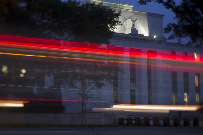 © Bloomberg. The Marriner S. Eccles Federal Reserve building stands past passing vehicles in this photograph taken with a tilt-shift lens in Washington, D.C., U.S., on Tuesday, Sept. 1, 2015. 