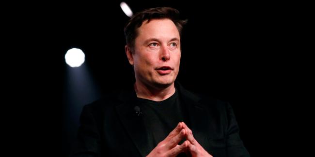 © Bloomberg. Elon Musk, co-founder and chief executive officer of Tesla Inc., speaks during an unveiling event for the Tesla Model Y crossover electric vehicle in Hawthorne, California, U.S., on Friday, March 15, 2019. Musk said the cheaper electric crossover sports utility vehicle (SUV) will be available from the spring of 2021. The vehicle's price will start at $39,000, a longer-range version will cost $47,000. Photographer: Bloomberg/Bloomberg