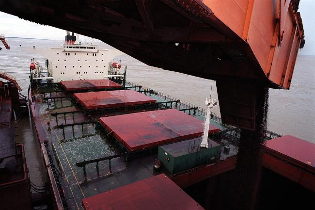 © Bloomberg. Part of a cargo of 168 tons of iron ore is loaded onto a ship at Cia. Vale do Rio Doce's port facility at Sao Luis, Brazil, on Wednesday, April 7, 2004. The reason: China. 