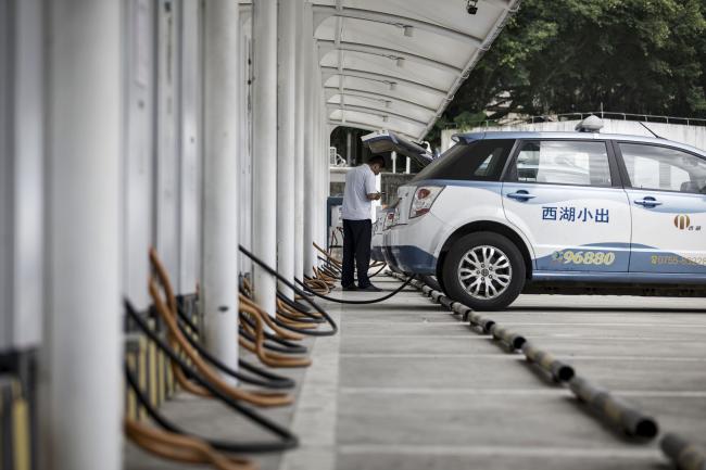Electric Car Stocks Jump as China Signals Lull in Subsidy Cuts