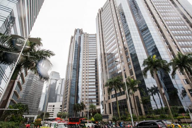 © Bloomberg. The Indonesia Stock Exchange (IDX) complex, right, stands in Jakarta, Indonesia. Photographer: Graham Crouch/Bloomberg