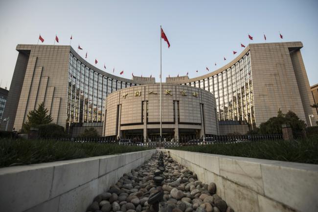 © Bloomberg. The People's Bank of China headquarters stand in Beijing, China, on Monday, Oct. 23, 2017. China's central bank is said to have gauged demand for 63-day reverse repurchase agreements for the first time ever. Photographer: Qilai Shen/Bloomberg