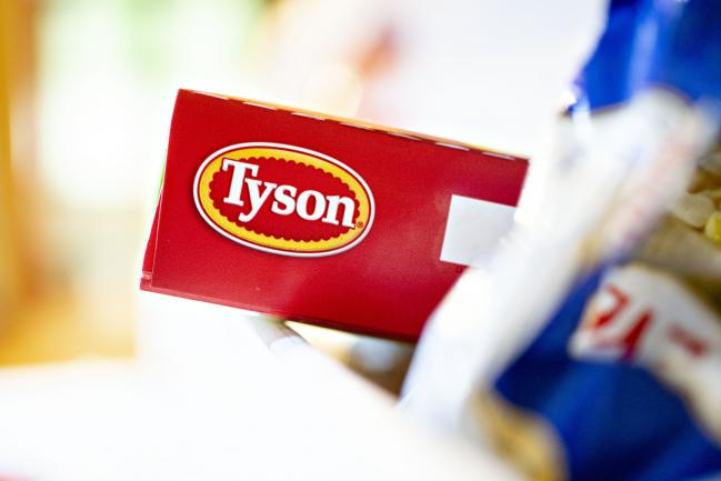 &copy Bloomberg. The Tyson Foods Inc. logo is seen on a box arranged for a photograph in Tiskilwa, Illinois, U.S., on Monday, Aug. 6, 2018. The largest U.S. meat company posted better-than-expected fiscal third-quarter earnings as beef demand rose and cattle costs fell, Tyson said Monday in a statement. 