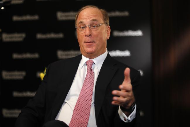 © Bloomberg. Larry Fink, chief executive officer of BlackRock Inc., gestures as he speaks ahead of a Bloomberg Television interview at the Blackrock Inc. wealth symposium in Zurich, Switzerland, on Thursday, March 7, 2019. Policy mistakes such as a hard Brexit pose the greatest risk amid a synchronized global slowdown, according to Blackrock Vice President Philipp Hildebrand. 