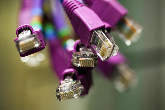 © Bloomberg. Terminals of data cables sit inside a comms room at an office in London, U.K., on Friday, Oct. 16, 2015. A group of Russian hackers infiltrated the servers of Dow Jones & Co., owner of the Wall Street Journal and several other news publications, and stole information to trade on before it became public, according to four people familiar with the matter. 