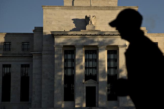 © Bloomberg. A runner passes the Marriner S. Eccles Federal Reserve building in Washington, D.C., U.S., on Friday, Nov. 18, 2016. Federal Reserve Chair Janet Yellen told lawmakers on Thursday that she intends to stay in the job until her term expires in January 2018 while extolling the virtues of the Fed's independence from political interference.