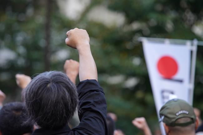 © Bloomberg. A protester at Sunday's rally. Photographer: Takaaki Iwabu/Bloomberg