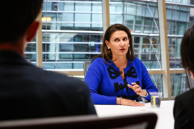 © Bloomberg. Sheila Patel, chief executive officer of International Goldman Sachs Asset Management (GSAM), speaks during an interview in New York, U.S., on Tuesday, March 13, 2018. Unlike past market corrections, when developing nations suffered big outflows, the money manager's clients have been increasingly clambering into riskier assets, Patel said.