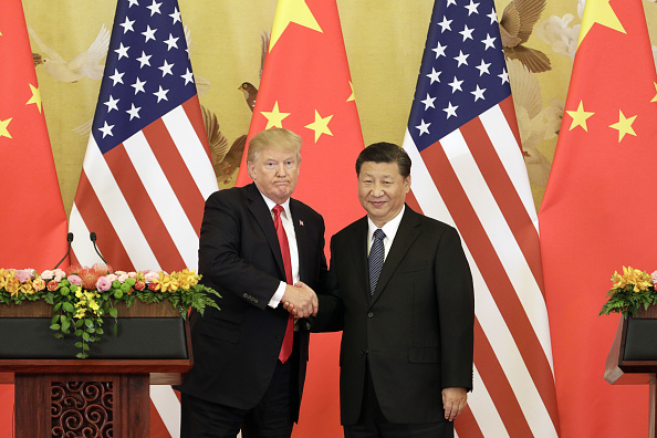 © Bloomberg. FILE: U.S. President Donald Trump, left, and Xi Jinping, China's president, shake hands during a news conference at the Great Hall of the People in Beijing, China, on Thursday, Nov. 9, 2017. Donald Trump and Vladimir Putin will meet in Helsinki, Finland, on July 16 for their first bilateral summit as the leaders seek to reverse a downward spiral in relations that has been exacerbated by findings that Russia meddled in U.S. elections. Our editors select a set of archive images of U.S. President Donald Trump ahead of the summit meeting. Photographer: Bloomberg/Bloomberg