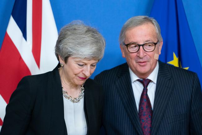 © Bloomberg. Theresa May and Jean-Claude Junckerin Brussels, on Feb. 20. Photographer: Jasper Juinen/Bloomberg