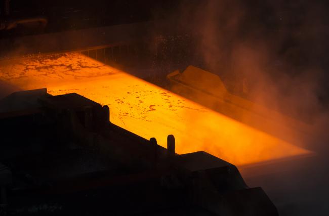 © Bloomberg. A hot steel slab moves along a conveyor of a plate mill at the Nippon Steel & Sumitomo Metal Corp. plant in Kashima, Ibaraki, Japan, on Wednesday, April 18, 2018. President Donald Trump and Japanese Prime Minister Shinzo Abe committed Wednesday to intensify bilateral trade talks. Trump is pushing for an agreement that would reduce the U.S. trade deficit with Japan, while Abe is seeking an exemption from the steel and aluminum tariffs that Trump announced last month. 