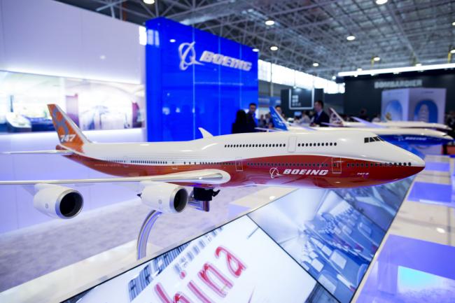 © Bloomberg. A model Boeing 747 8I Intercontinental aircraft, manufactured by Boeing Co., stands on display during the China International Aviation & Aerospace Exhibition in Zhuhai, Guangdong province, China. 