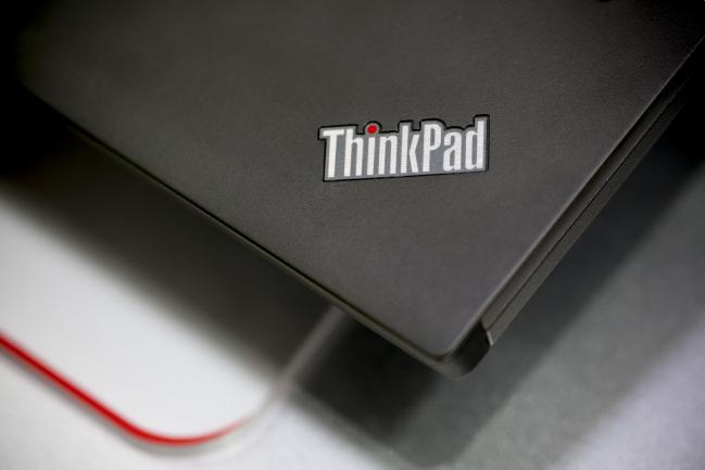 © Bloomberg. The ThinkPad logo is displayed on a Lenovo Group Ltd. ThinkPad W530 laptop at a Lenovo store in the Yuen Long district of Hong Kong, China, on Friday, May 23, 2014.  Photographer: Brent Lewin/Bloomberg 