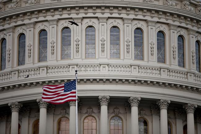 © Bloomberg. The American flag flies at the U.S. Capitol in Washington, D.C., U.S., on Wednesday, Sept. 27, 2017.