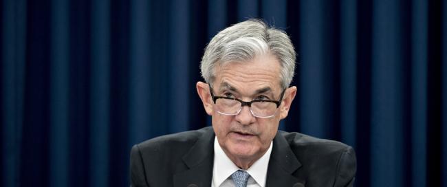 © Bloomberg. Jerome Powell, chairman of the U.S. Federal Reserve, speaks during a news conference following a Federal Open Market Committee (FOMC) meeting in Washington, D.C., U.S., on Wednesday, March 21, 2018. Federal Reserve officials, meeting for the first time under Powell, raised the benchmark lending rate a quarter-point and forecast a steeper path of hikes in 2019 and 2020, citing an improving economic outlook. Policy makers continued to project a total of three increases this year.