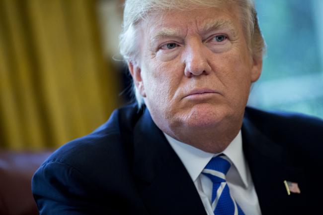 © Bloomberg. U.S. President Donald Trump listens during an interview in the Oval Office of the White House in Washington, D.C., U.S., on Monday, May 1, 2017. Trump said he would meet with North Korean leader Kim Jong Un amid heightened tensions over his country's nuclear weapons program if the circumstances were right.