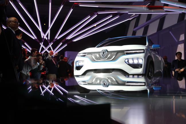 © Bloomberg. The Renault SA K-ZE electric sports utility vehicle (SUV) stands after unveiling during the Tomorrow in Motion event ahead of the Paris Motor Show in Paris, France, on Monday, Oct. 1, 2018. With luxury automakers Lamborghini, Bentley, Rolls-Royce, Aston Martin, Maserati, and McLaren all skipping, Germany will be the source of the most attention-grabbing cars at this years show, also known as Mondial de L'Automobile, which runs from Oct. 4 - 14. 