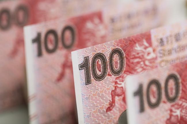 © Bloomberg. Hong Kong one-hundred dollar banknotes are arranged for a photograph in Hong Kong, China. Photographer: Justin Chin