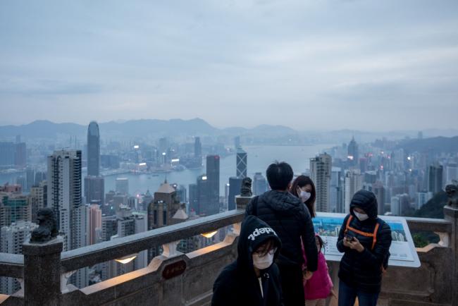 Hong Kong’s Muted Stock Swings Stand Out Amid Global Turbulence