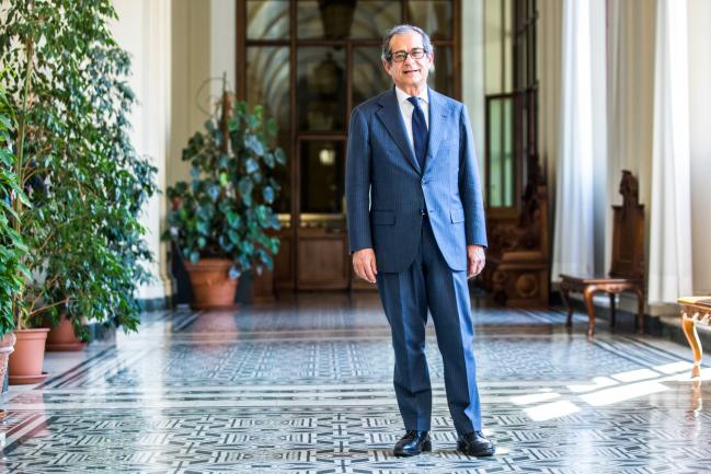 &copy Bloomberg. Giovanni Tria, Italy's finance minister, poses for a photograph following an interview at the finance ministry in Rome, Italy, on Wednesday, July 4, 2018. The Italian Treasury has asked for European regulatory approval of a six-month extension of its state-guarantee program for banks’ bad loans, Tria said. 