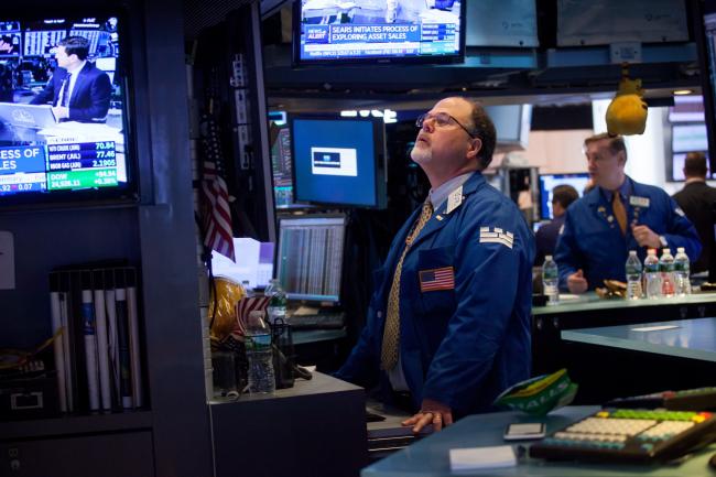 © Bloomberg. A trader works on the floor of the New York Stock Exchange (NYSE) in New York, U.S., on Monday, May 14, 2018. U.S. stocks edged higher as trade tensions between the world's two biggest economies showed signs of abating. 