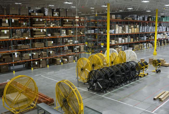 © Bloomberg. Industrial fans sit on the factory floor at a Big Ass Fans LLC manufacturing facility in Lexington, Kentucky, U.S., on Tuesday, Feb. 20, 2018. The Institute for Supply Management is scheduled to release ISM manufacturing figures on March 1. Photographer: Ty Wright/Bloomberg