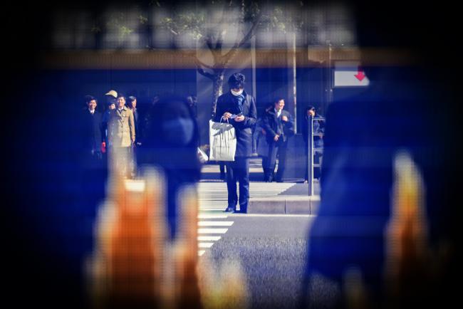 © Bloomberg. A man is reflected in an electronic stock board outside a securities firm in Tokyo, Japan, on Tuesday, Feb. 6, 2018. 