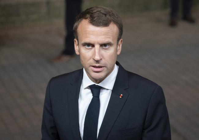 Â© Bloomberg. Emmanuel Macron, France's president, departs following a European Union (EU) leaders summit in Brussels, Belgium, on Friday, June 29, 2018.