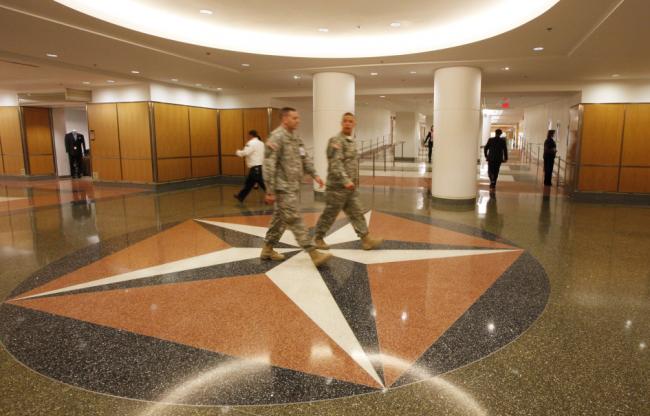 © Bloomberg. People walk through a newly-renovated corridor at the Pentagon in Arlington, Virginia, U.S., on Tuesday, July 12, 2011.