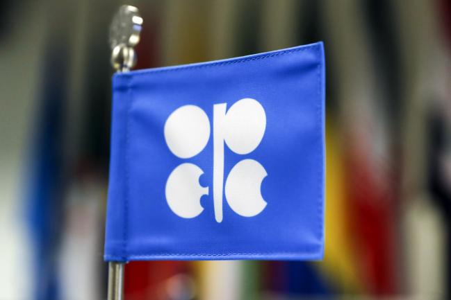 © Bloomberg. The flag of OPEC stands on a desk ahead of the 174th Organization Of Petroleum Exporting Countries (OPEC) meeting in Vienna, Austria, on Friday, June 22, 2018. OPEC and its allies reached a preliminary agreement in the face of strong opposition from Iran to boost production by a theoretical 1 million barrels a day - the actual increase will be smaller as several countries are unable to raise output. 