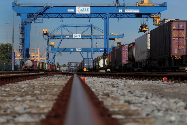 &copy Bloomberg. Shipping containers stand on wagons at the railway terminal railyard at Duisport shipping port in Duisburg, Germany, on Tuesday, Sept. 11, 2018. The trade route known in Beijing as the Belt and Road Initiative is spurring $1 trillion of investment on rail, highways and ports linking Europe and Asia. 